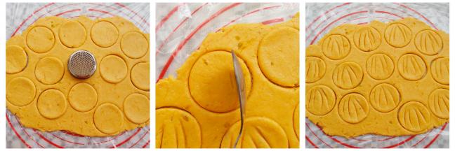 南瓜面团擀成一个大面饼，用一个大的圆形工具印出饼干胚，用勺子立起来在饼干胚上印4条缝（多出来的边角碎料我用来做手指饼干，也可以继续擀出来做南瓜饼干）