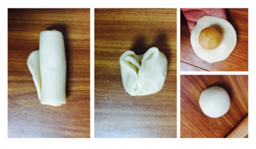 把卷起来的竖着放。按扁，再擀成长条。再卷起来，两端捏一起，揉圆。也是20个都做了，做完最后一个第一个也好了。然后擀皮，中间厚两边薄，包一个馅进去。收口朝下放置。