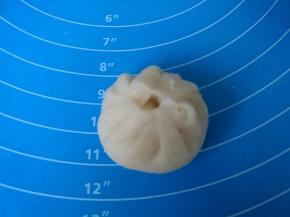 捏成包子的样子。