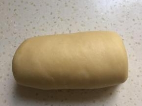 反过来光面向下，自上向下卷起来，卷二圈半左右