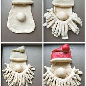 提着胡子的两段放在鼻子下面，两端塞进脸后面。把胡子扭一扭，圣诞老人完工。帽子我用了色素染了染。
放在烤盘里发酵，发酵好的面团刷上蛋液。
180度25分钟