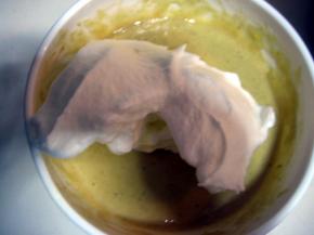 取1/3打发的蛋白至蛋黄面糊中翻拌均匀，然后再取1/3蛋白至面糊中翻拌均匀；