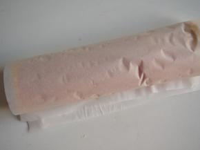 将蛋糕卷起，用油纸包好放入冰箱冷藏定型后切开即可