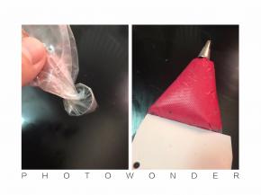 马卡龙专用裱花嘴，这里我用的是三能7066，套进去裱花袋，顶端拧一下然后套个大口径水杯里，灌入面糊，用大刮铲往前推面糊