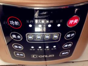 轻触开关键，再按功能键，选择到“米糊”功能，再按开关键