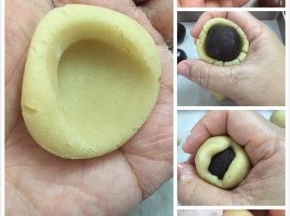 包馅步骤，先粘着面粉在手，然后放一个皮，中间按下去，推成一个小碗状，放进一个豆沙馅，然后慢慢的往虎口推，要慢慢的推，这一步要慢慢的推不能着急！
