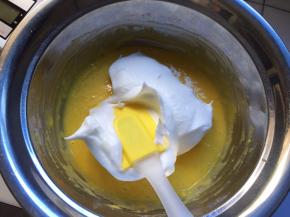 将蛋白分一半到蛋黄糊中搅拌均匀，从下往上搅拌