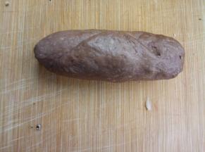 从上往下卷住，收紧口；