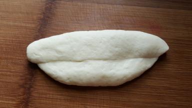 11．再折一个1/4，压紧实。