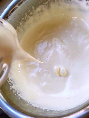 分多次加入搅拌好的麦芽牛奶水，继续打发至打蛋器提起，蛋液会很顺滑的留下来，隔个几秒才消失