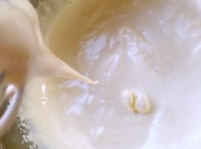 分多次加入搅拌好的麦芽牛奶水，继续打发至打蛋器提起，蛋液会很顺滑的留下来，隔个几秒才消失