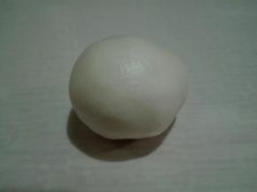 捏紧收口包好，收口朝下