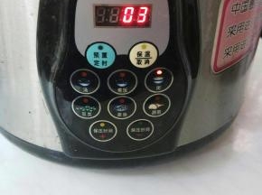 按下煮粥键。