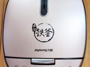 合上电饭煲盖子，选择精煮饭功能。