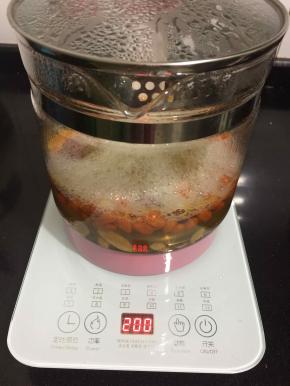 煮开后选择200火力小火熬煮