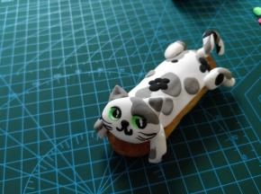 也可以做成趴在泡芙上的小猫。