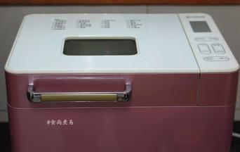 遮上面包机盖子，接通电源，选择年糕功能键，按启动即可