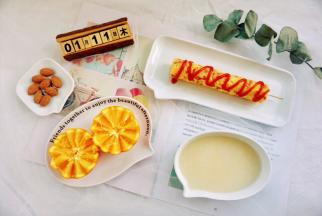  今日早餐：火腿鸡蛋米饭肠+小米粥+橙子+扁桃仁。