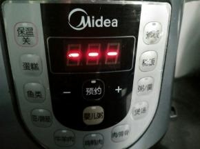 按煮粥键。