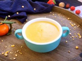 将玉米面粥盛入小碗里。