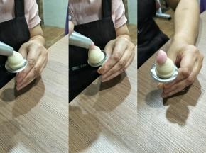 韩式122花嘴，轻轻插入花柱，挤，花嘴向上提，转上一圈半，向下拉，一个花心就做好了