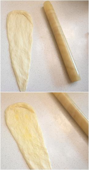 将松弛后的面团擀长，翻面后抹上适量软化的有盐黄油。