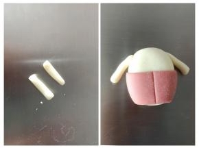 将红色衣服粘到身体上，白色面团做两个手臂