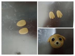 各1.5克面团搓成水滴状，压扁，用刮板压出纹路，做天天的耳朵，如图将鼻子眼睛耳朵都粘好