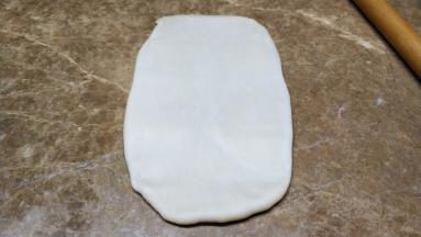 用擀面杖擀成长方型