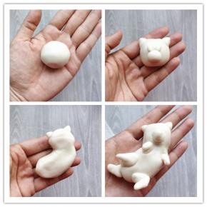 9.封口捏好后搓圆。10.先制作单个柴犬头部：在包了豆沙馅的球形中下部粘上一个小球，充当柴犬的嘴巴，再取两小块，捏成三角形，充当柴犬的耳朵。两个小圆粒当眉毛。11.如果制作整个翻着肚皮的柴犬，将包着豆沙馅的小球搓成长条，整理一下形状，做出扭动的姿态。12.同样做好耳朵、四肢和尾巴，粘在适当的位置。