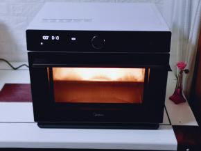 纯鲜嫩蒸功能，100°蒸15分钟，时间到后不要急着将门打开，切记焖5分钟再打开门！我用的是美的蒸烤箱型号是s5-l300e。