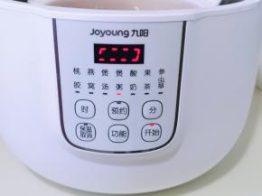 按四下“功能键”选煲粥。