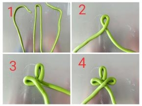 圣诞树做法：取40克绿色面团也是搓成长条，粗细跟筷子差不多，如图所示从中间折一下，左边折回来，右边也同样折回来，如此一左一右一层比一层长一点