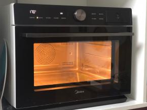 美的蒸烤箱预热170度