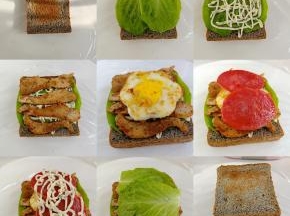 下面铺一块保鲜膜，放吐司片，放生菜，挤沙拉酱，放鸡胸肉，鸡蛋，培根火腿片，再挤一些沙拉酱盖上生菜，最后再盖一片吐司