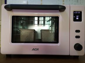 14、将吐司盒放入烤箱，设定发酵功能。