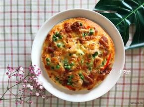 烤箱温度调整为200度，提前预热，将披萨放入烤盘中层，烤15分钟取出即可