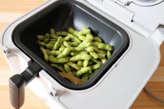 根据提示放入毛豆，再点击开始按钮；