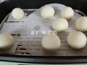 用虎口收口，收口朝下，放在蒸屉里