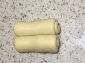两边都卷起来，卷成这样