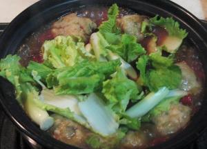 放入青菜心，待菜变软，即可关火