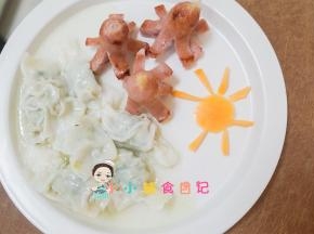 我煮了一些饺子，做了一个胡萝卜的太阳，她吃的可开心啦