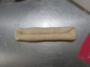 翻面，然后横放身前，上下各自折叠，压紧。