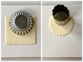 取一片白色芝士片，如图用花型蛋挞的模具压出花边，再用蝴蝶面模具圆的一端，扣出一个半圆。