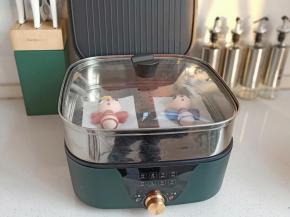 新思特魔方锅开火，水开后上锅蒸10分钟，关火后闷2分钟