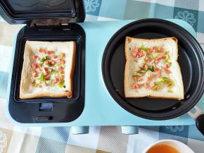 撒上火腿粒和葱花。