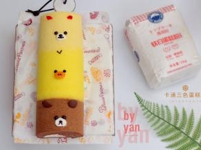 定型好的蛋糕卷头和尾切掉一点，分别用巧克力酱、淡奶油、杏仁片、粉色色素、巧克力豆、橙子皮画出卡通表情即可。