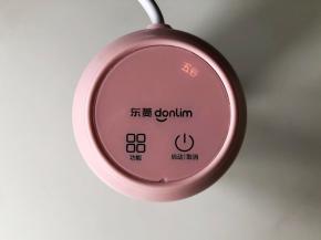 拧好搅拌加热上盖，插好电源，启动“五谷”功能。