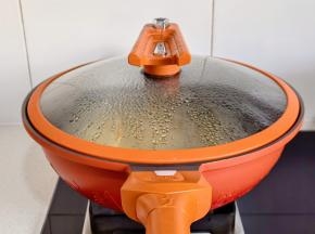 盖上盖子，小火煎至水干即可。